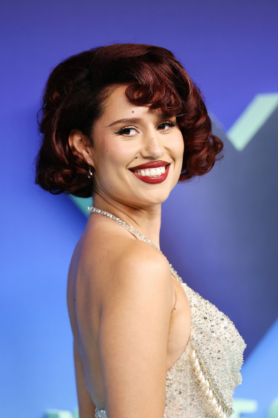 Raye smiling