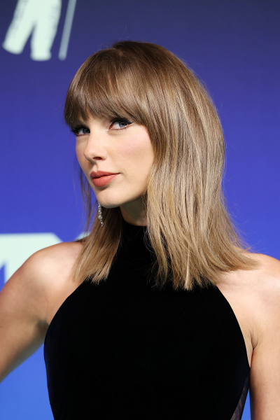 Image may contain Taylor Swift Blonde Hair Person Adult Face Head Photography Portrait and Hairdresser